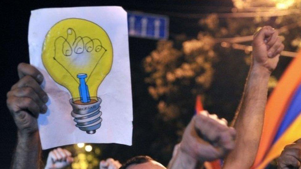 Protesters shout slogans during a demonstration against an increase of electricity prices in Yerevan early on 25 June 2015