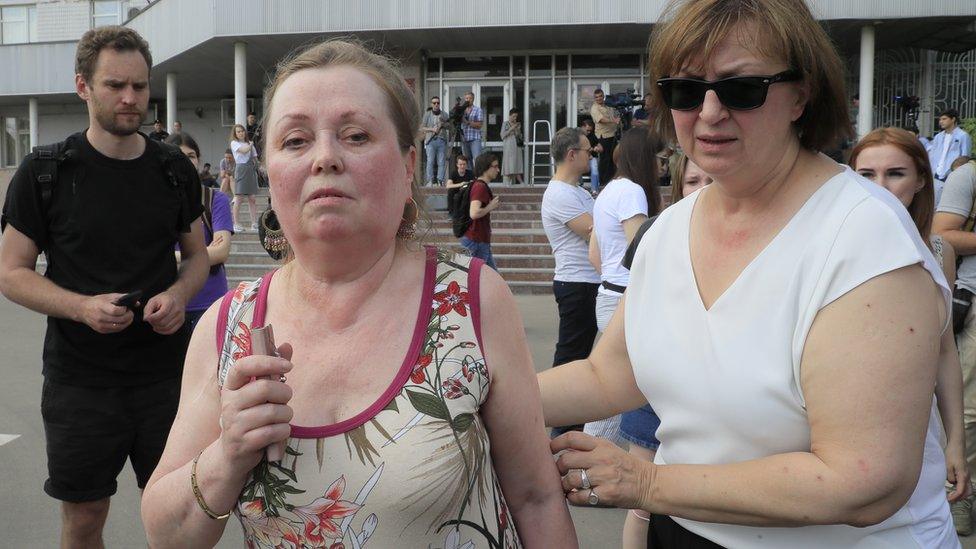 Galina Timchenko (R), CEO of online news portal Meduza, escorts Svetlana, mother of Russian investigative journalist Ivan Golunov, in Moscow, 8 June