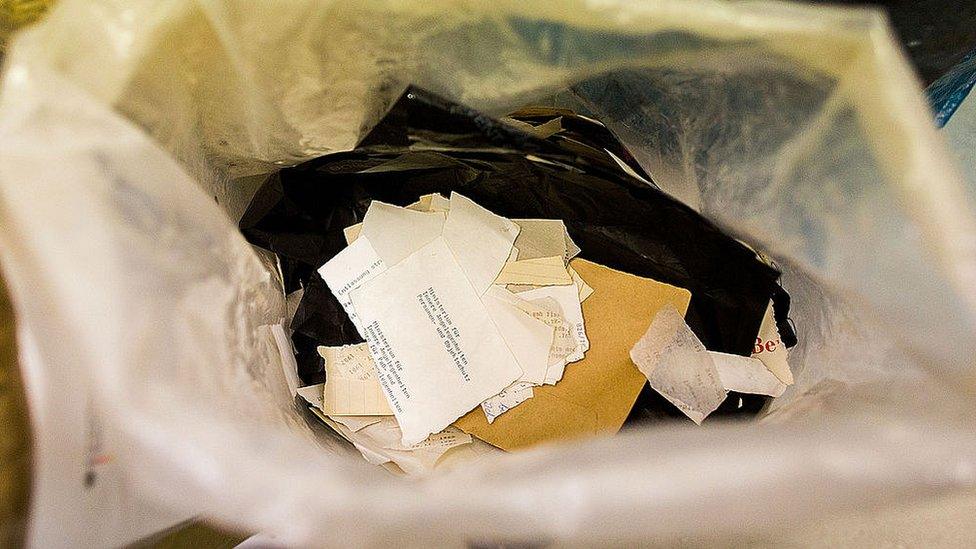 Torn documents of the former East German secret police fill a bag in the Stasi archive on September 17, 2014 in Berlin, Germany.