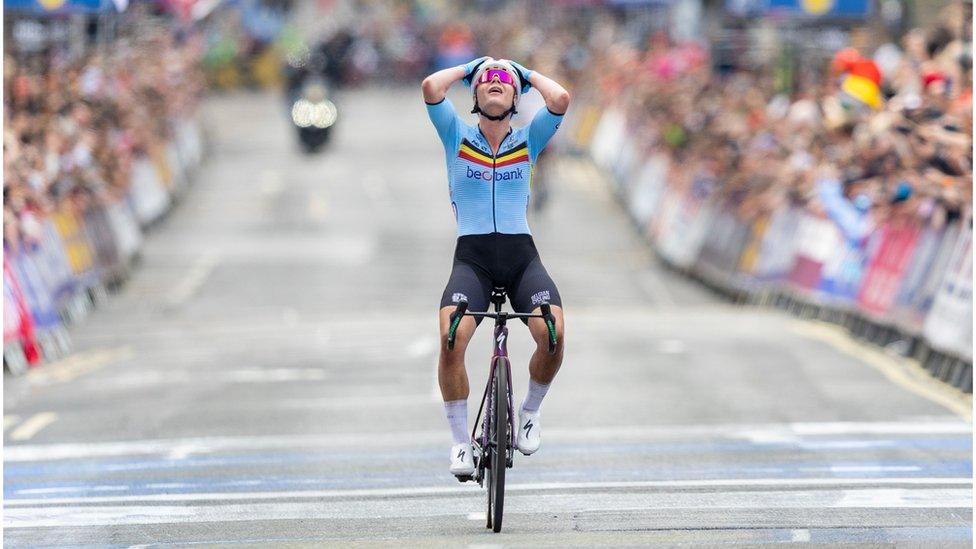 Belgium's Lotte Kopecky celebrates crossing the line at the women's road race