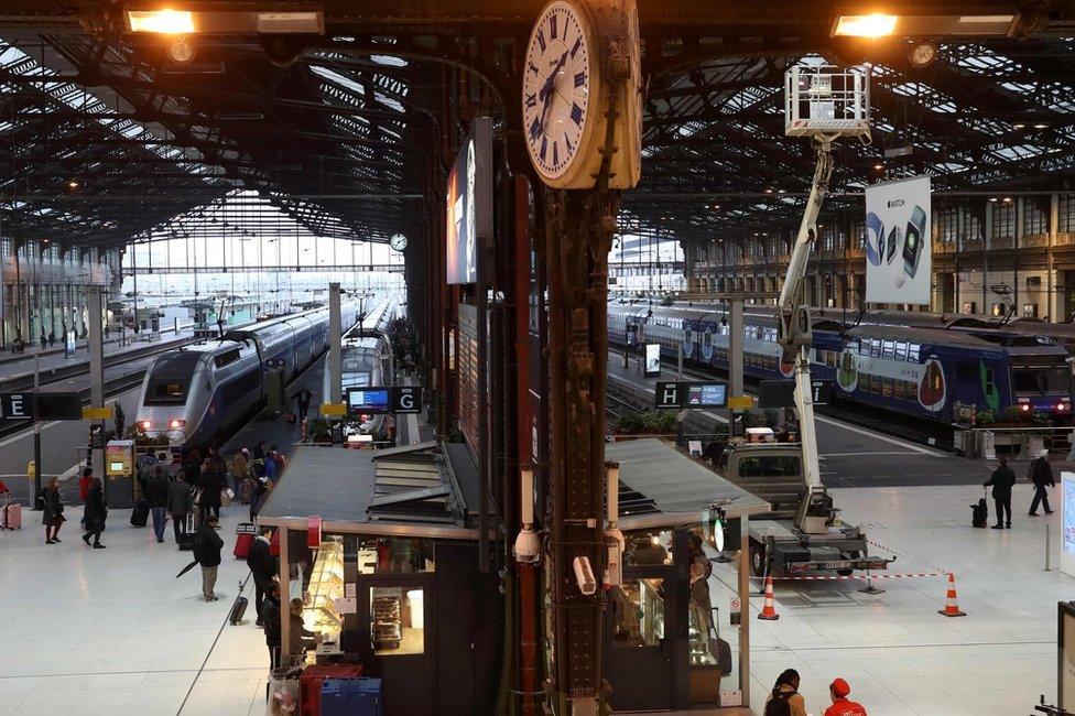 Passengers walk on a platform at the Gare de Lyon railway station on 1 June in Paris,