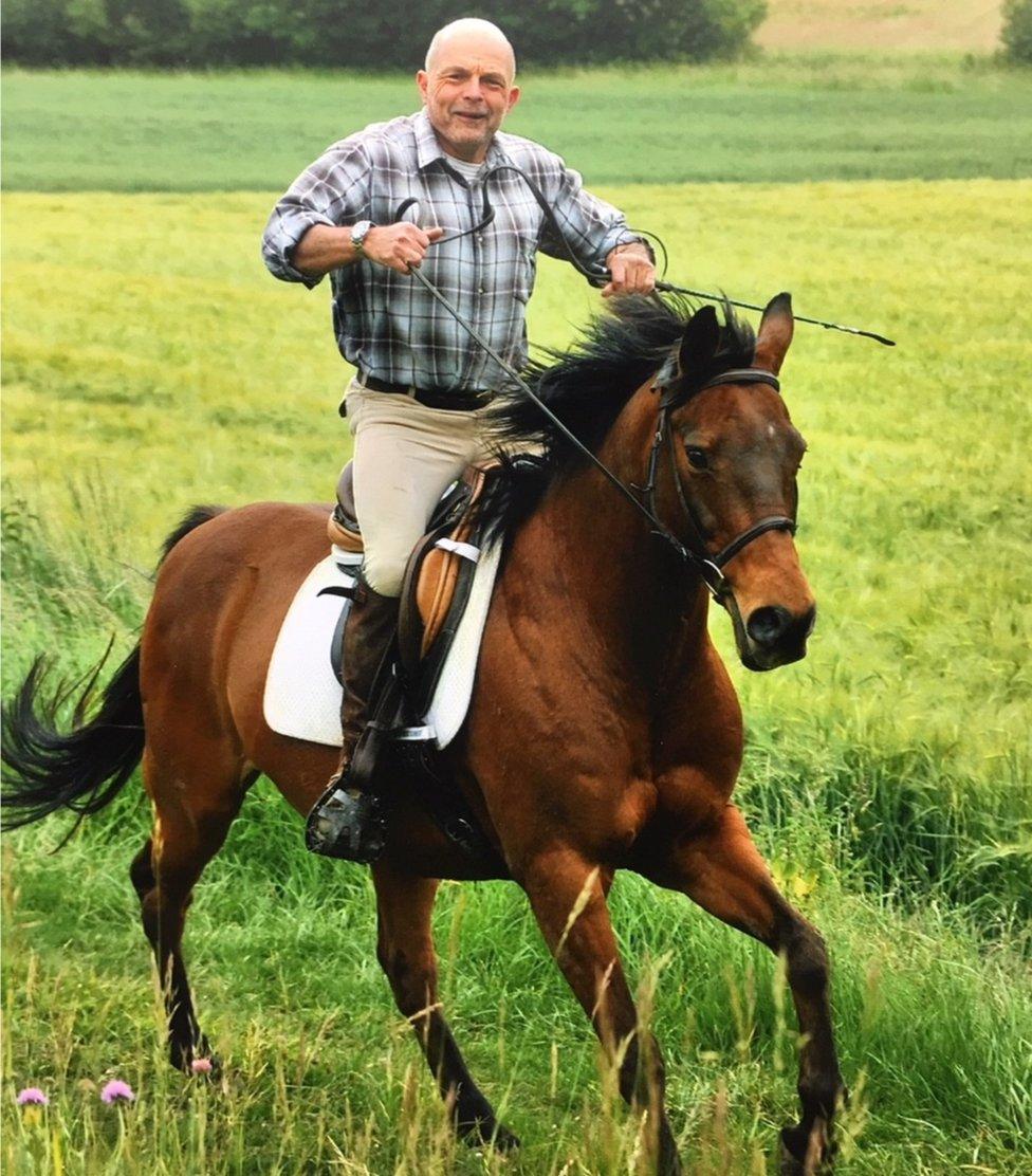 Mark riding one of his horses.