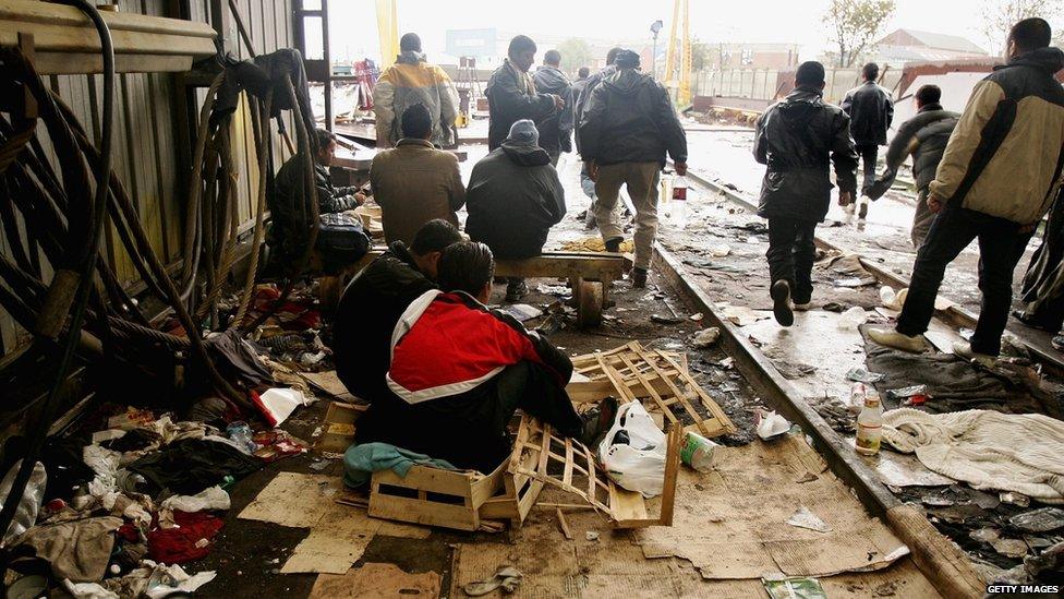 Men in squalid living conditions