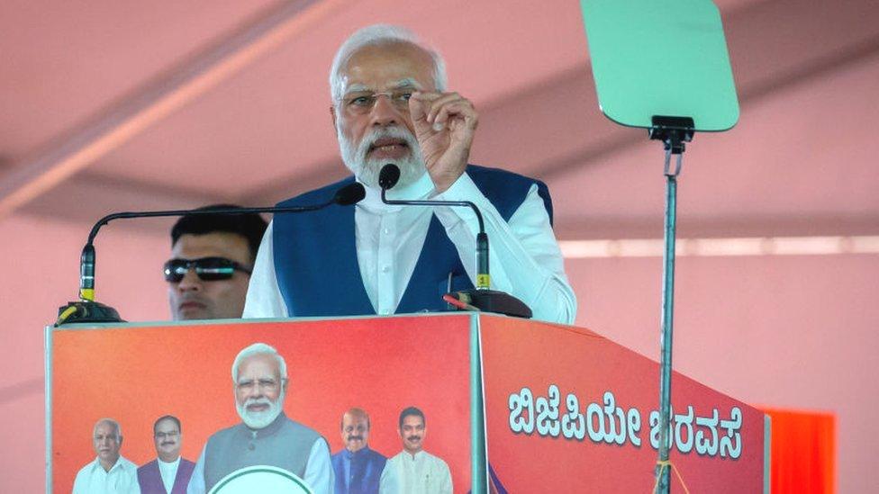 India's Prime Minister Narendra Modi addresses a gathering of supporters during a political event organised by the Bharatiya Janata Party (BJP) at the GMIT College Grounds on March 25, 2023 in Davangere, India.