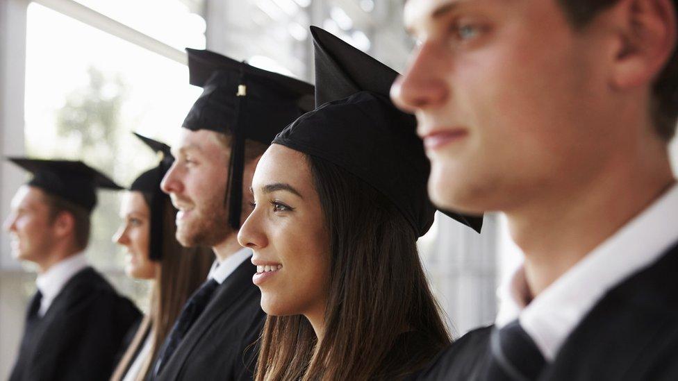 Graduates in gown and mortarboards