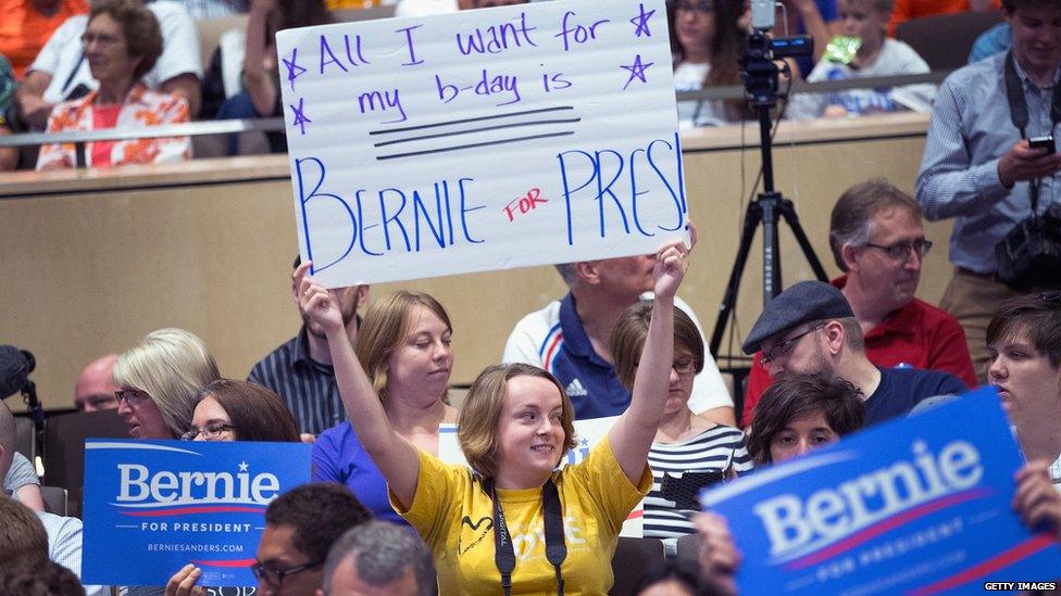 A Bernie Sanders supporter holds up a handmade sign.