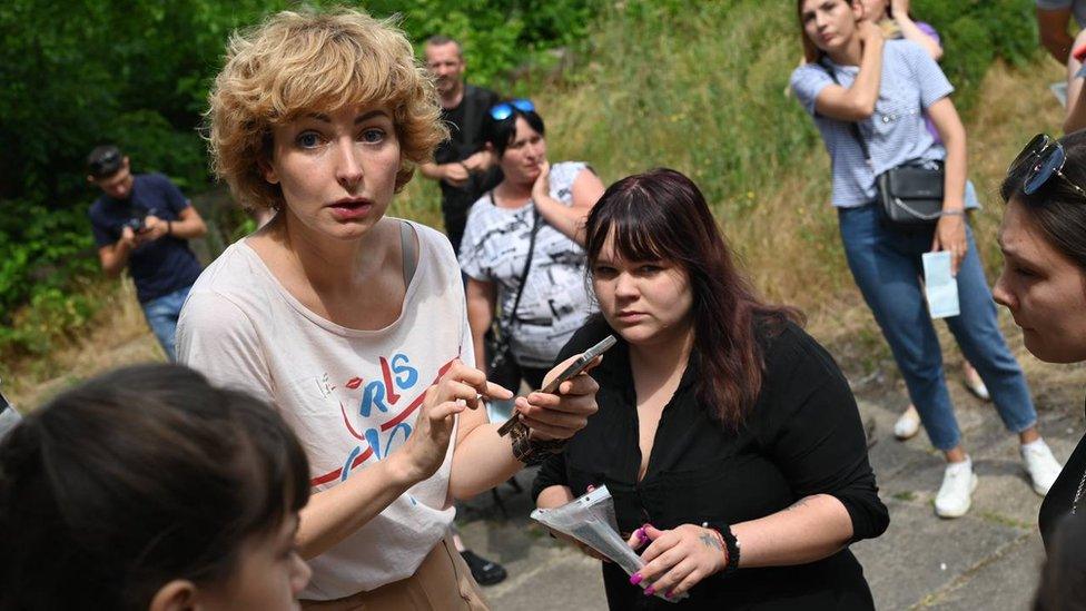 Tatyana Kumok helping distribute aid