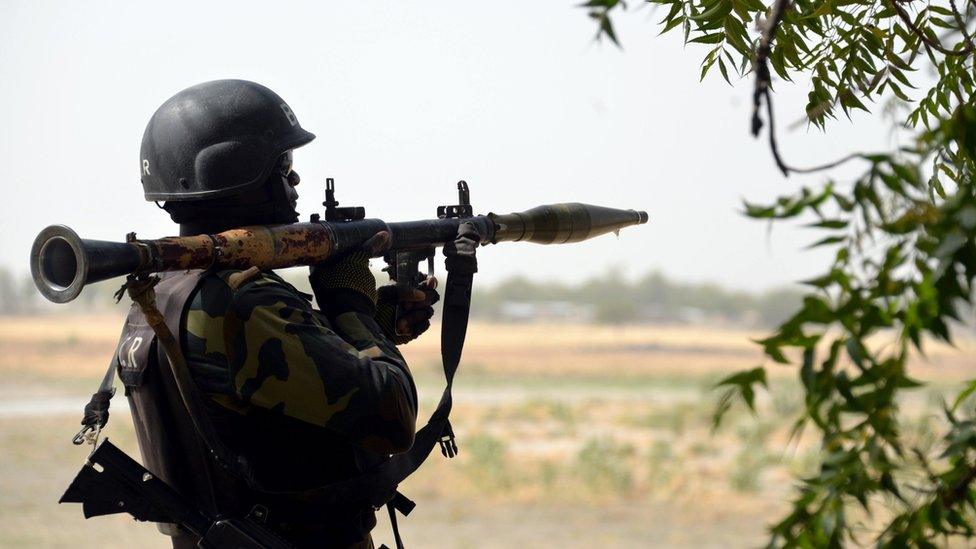 A picture taken on February 17, 2015 shows a Cameroonian soldier carrying a rocket launcher as he stands post in the Cameroonian town of Fotokol, on the border with Nigeria, after clashes occurred on February 4 between Cameroonian troops and Nigeria-based Boko Haram insurgents.