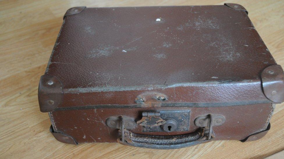 The suitcase the books were found in