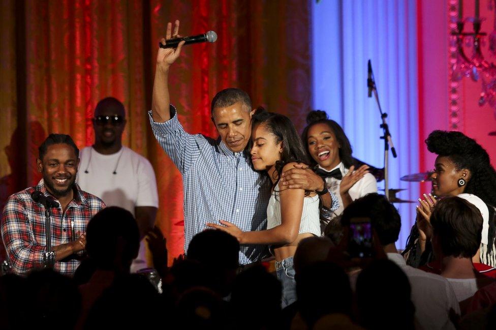 President Barack Obama hugs his daughter Malia Obama at the Fourth of July White House party on July 4, 2016 in Washington, DC. Guests including singers Janelle Monae and Kendrick Lamar.