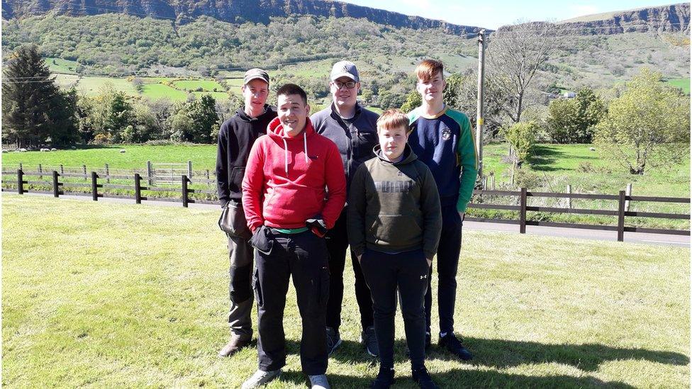 James (bottom right) with his brothers