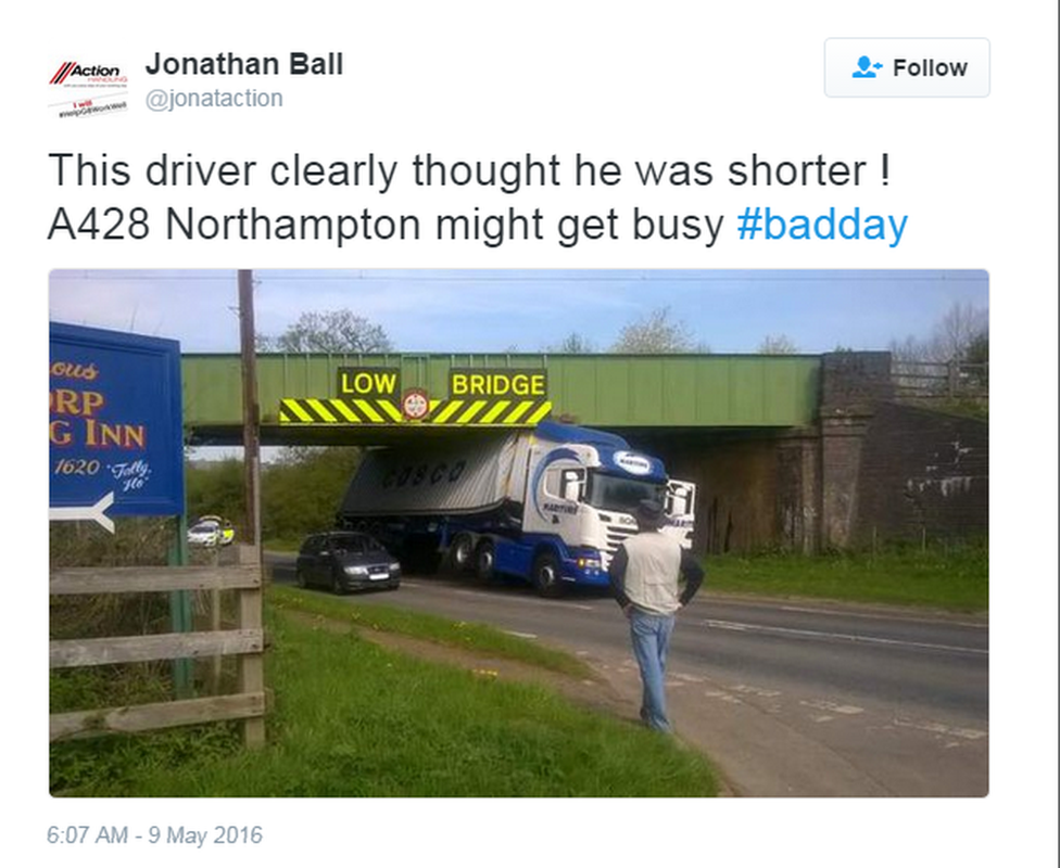 Tweet and image of lorry wedged under bridge