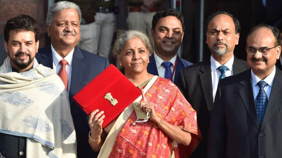 Union Minister of Finance Nirmala Sitharaman seen holding the Budget folder (bahi khata) along with Minister of State in the Ministry of Finance Anurag Thakur and other senior officials before leaving from Ministry of Finance to the Parliament to present Union Budget 2021-22, on February 1, 2021 in New Delhi, India.