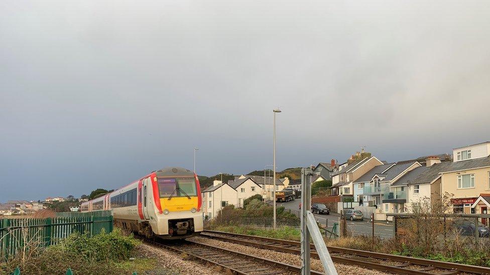 Train going over the railway crossing