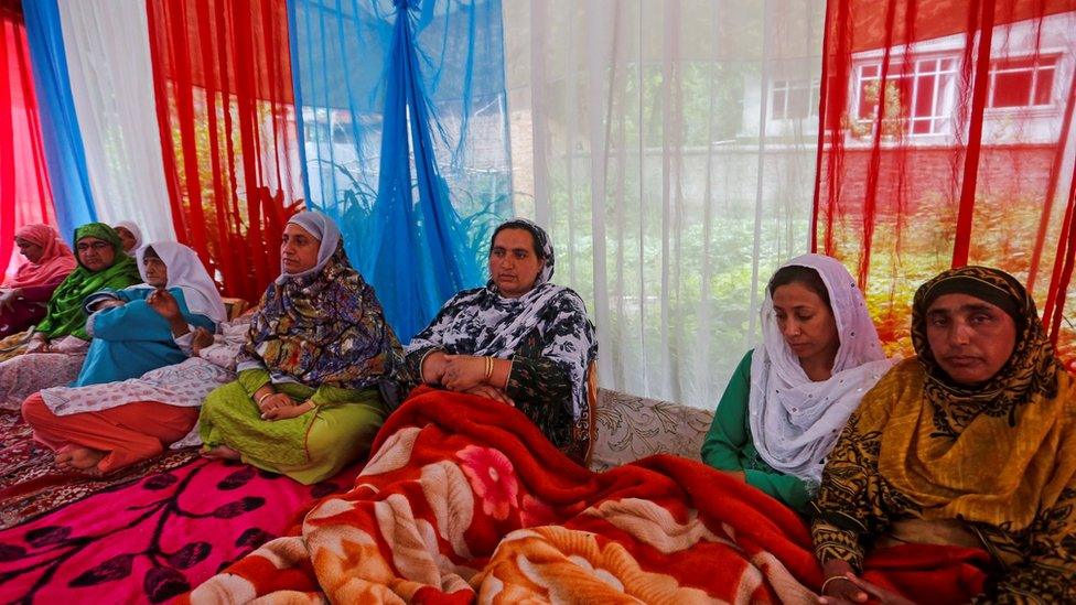 Mourners at Amreena Bhat's house in Budgam