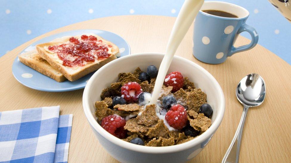 Bowl of cereal, coffee and toast