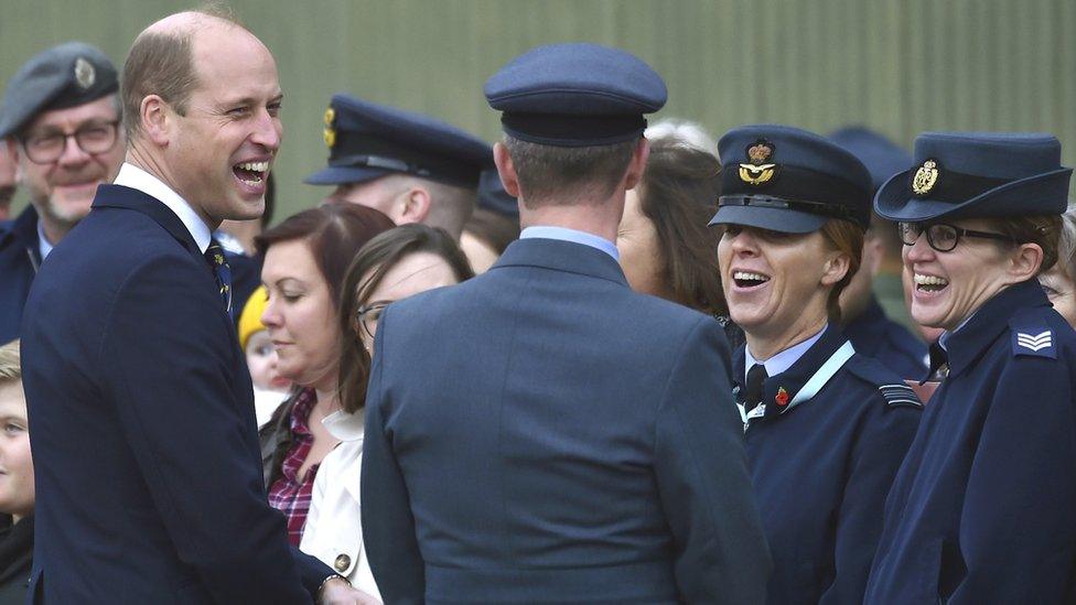 Prince William speaking with families