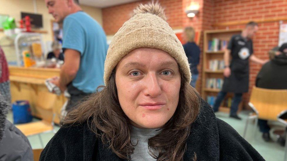 A women in a bobble hat