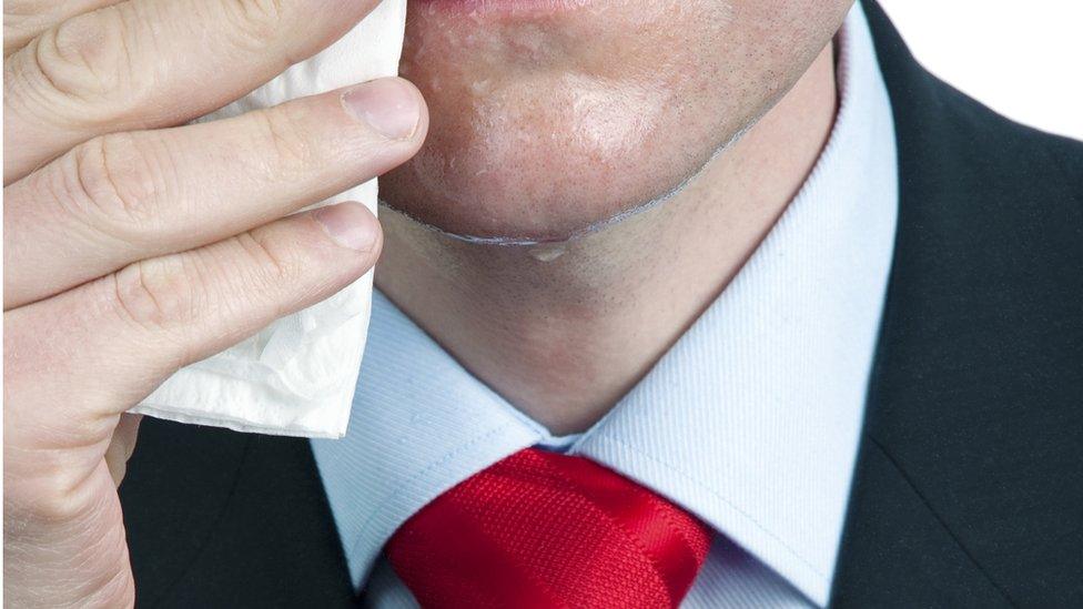 sweating man in tie