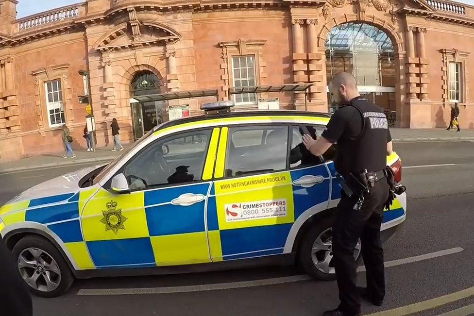 Ricky Slade in police car