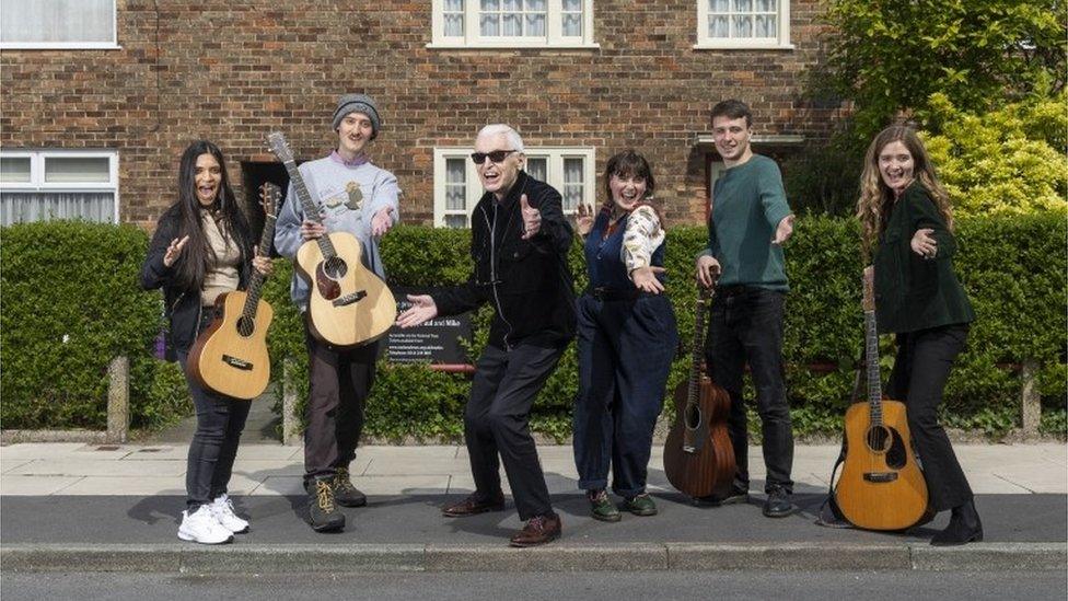 Mike McCartney, brother of Sir Paul McCartney (centre left), outside 20 Forthlin Road in Liverpool, their childhood home, with artists (left to right) Serena Ittoo, Dullan, Humm who are Carys Lewin and Arty Jackson, and Emily Theodora