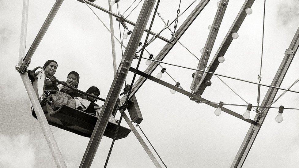 Indigenous people on a Ferris wheel in Mexico