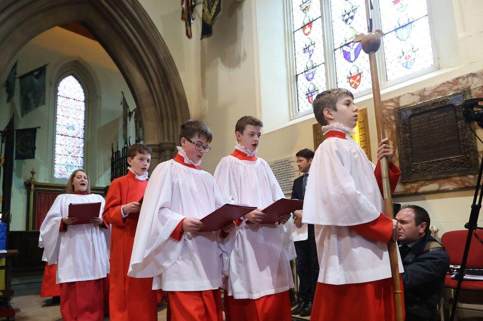 Choirboys walk through St Patrick's Cathedral during the thanksgiving service