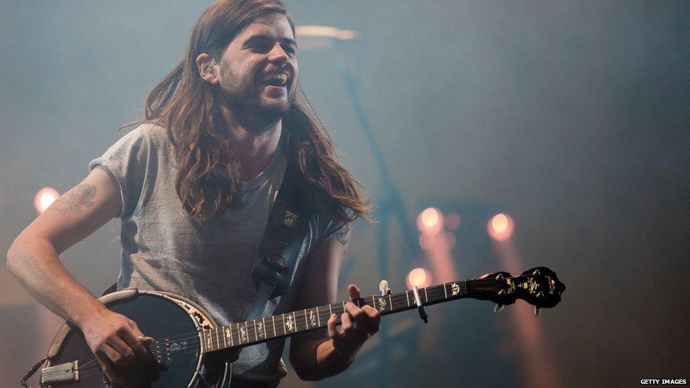 Mumford and Sons performing