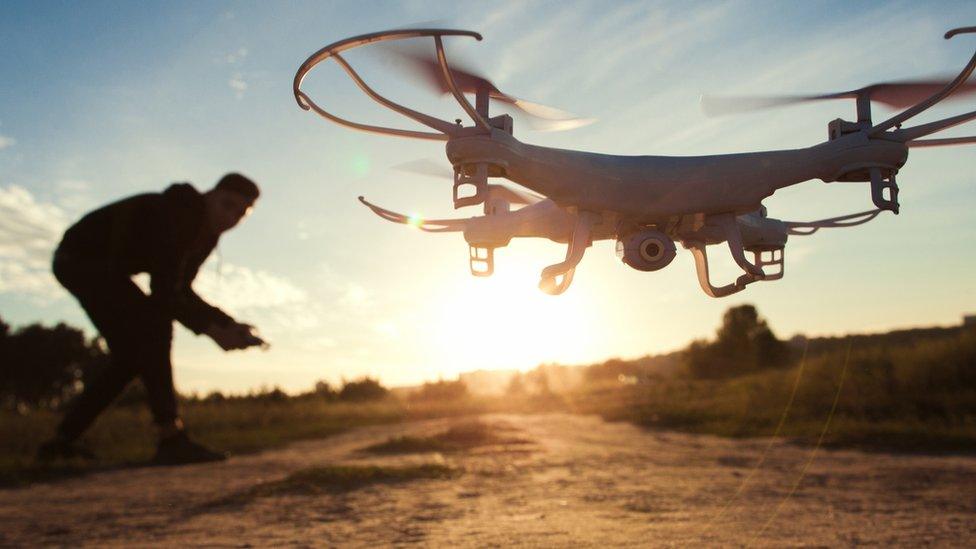 Man launching a drone