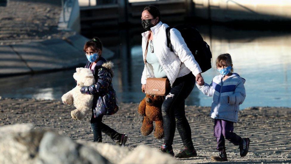 Migrants attempt to cross in to the U.S. from Mexico at the border October 10, 2021 in San Luis, Arizona.