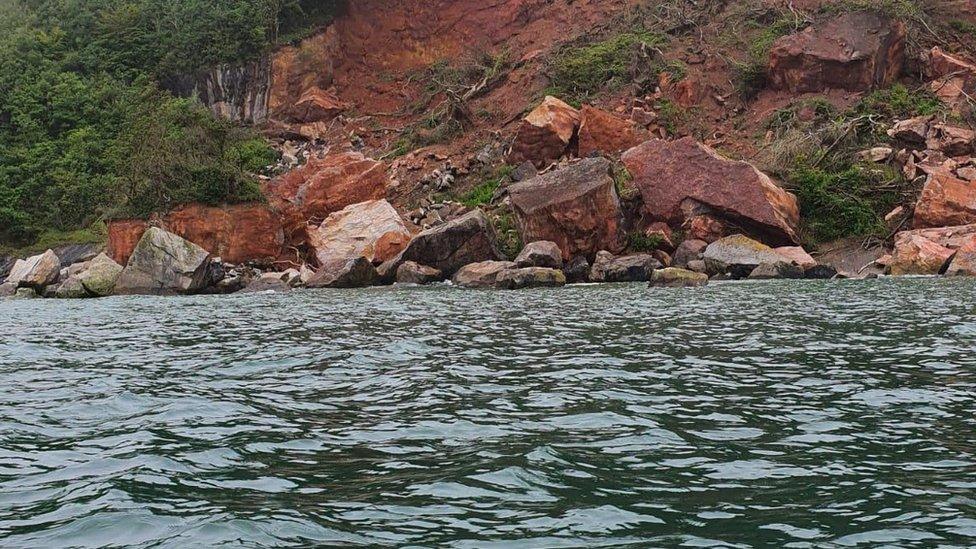 Two people were rescued by lifeboat after getting tapped by the tide