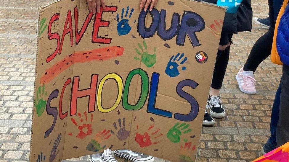 Sign saying Save Our Schools