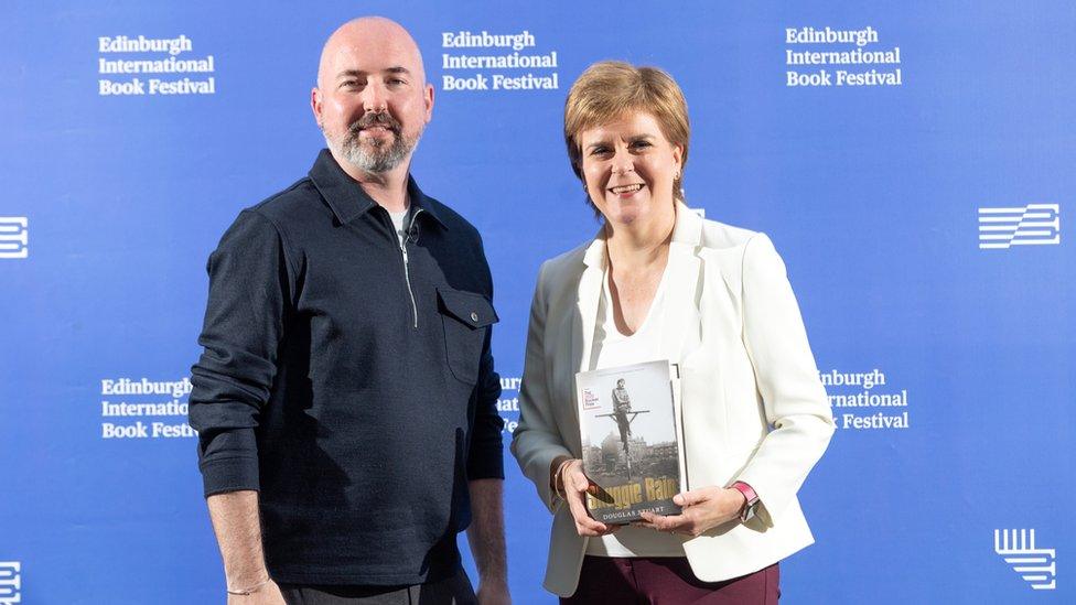 Scottish author Douglas Stuart and First Minister of Scotland Nicola Sturgeon attend a photocall at Edinburgh College of Art during the Edinburgh International Book Festival 2021 on August 30, 2021