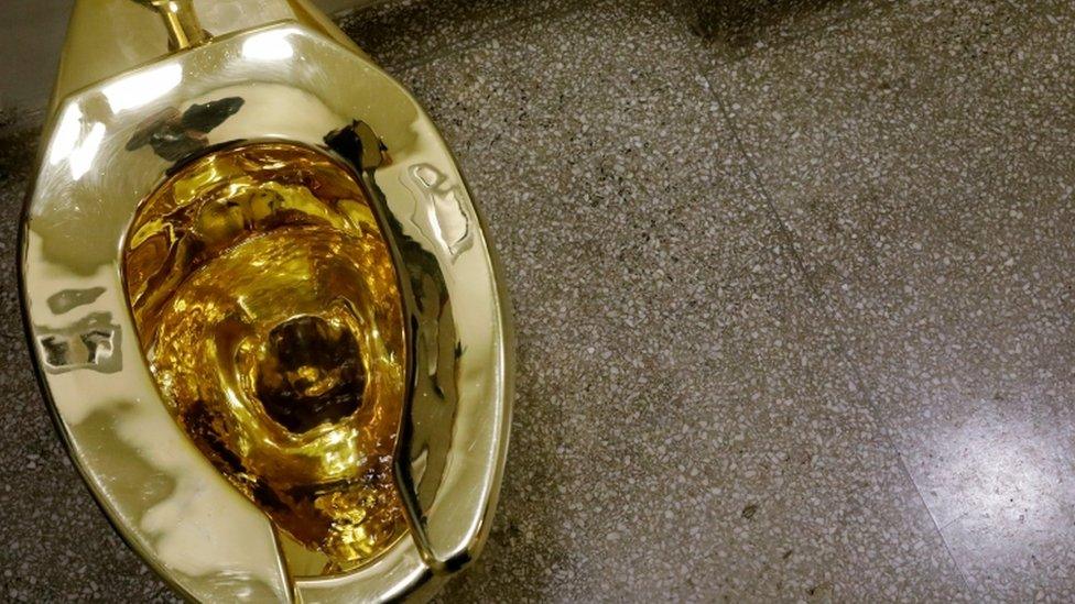 The fully functioning solid gold toilet created by Italian artist Maurizio Cattelan