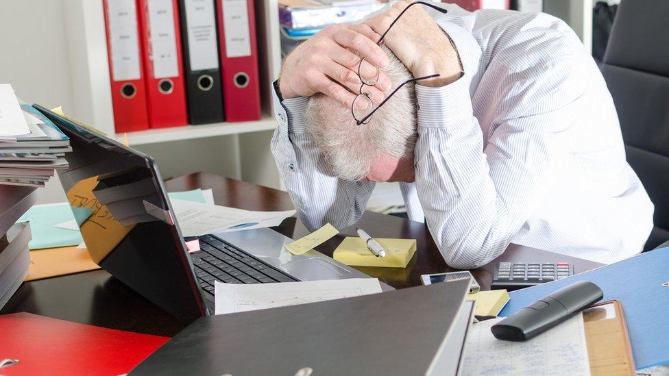 Upset man with computer