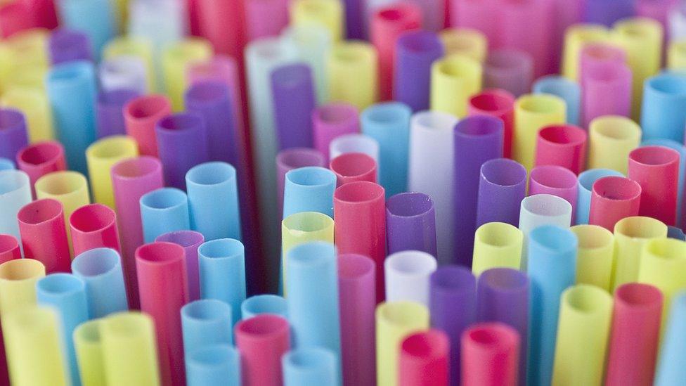 colourful plastic straws gathered together
