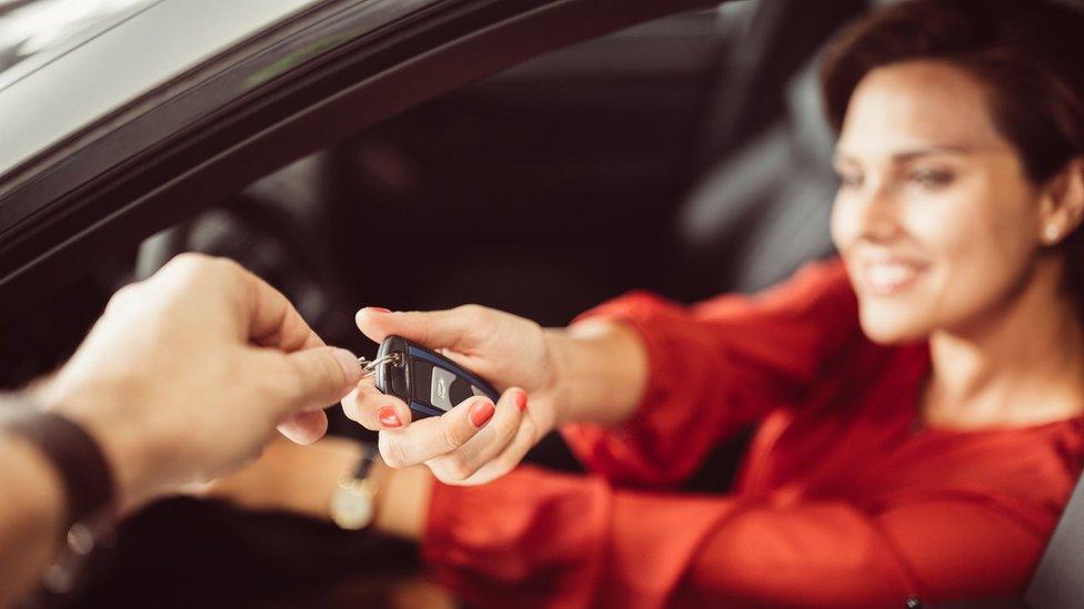 Woman buying a car