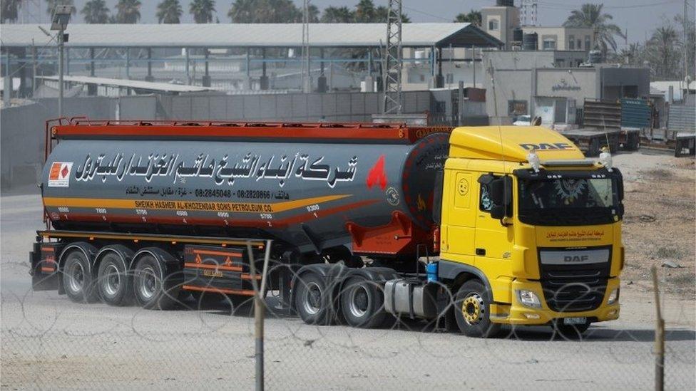 A truck carrying fuel imports for the lone power plant rolls into Gaza, after Israel eased up closures, as ceasefire holds in Rafah in the southern Gaza Strip, August 8, 2022.