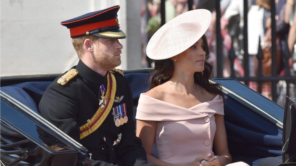 harry and meghan in a coach