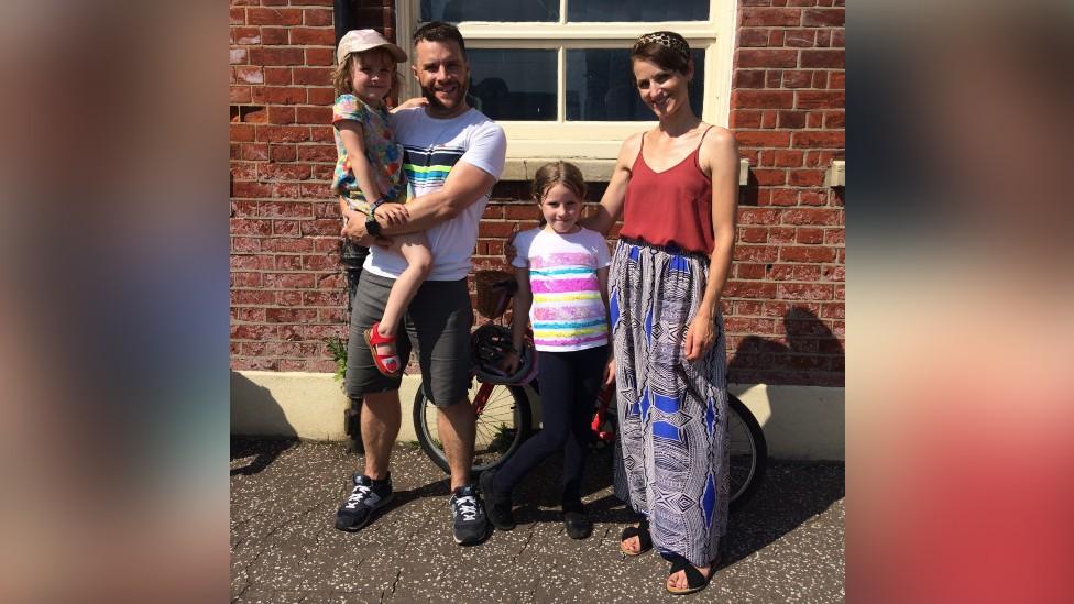 Hannah, pictured with husband Kelvin and their daughters Mollie and Nell