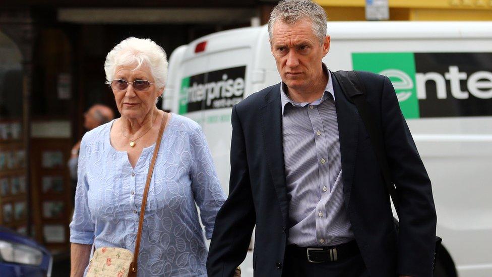 Maureen Lock, widow of Donald Lock, and her son Andrew arrive at Lewes Crown Court for the sentencing