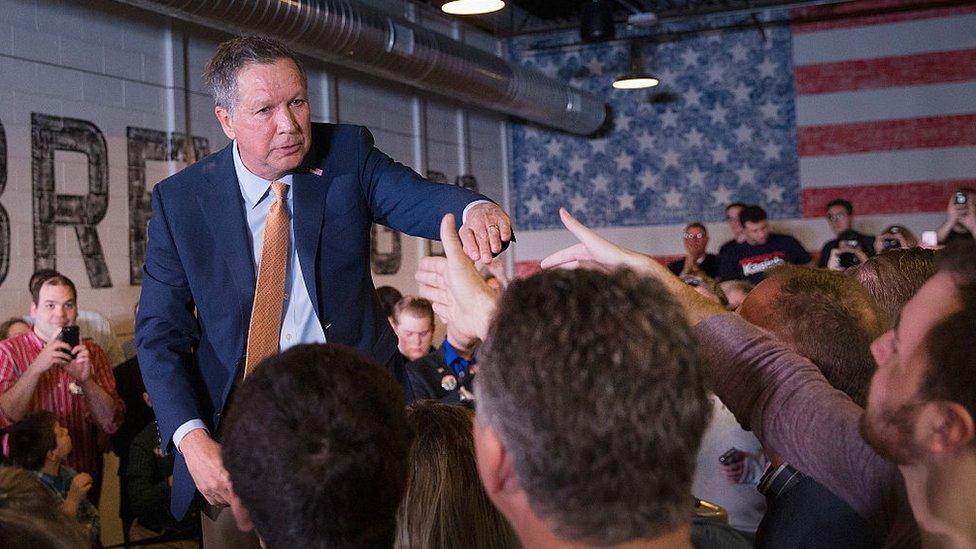 Republican presidential candidate Ohio Gov. John Kasich greets supporters following a rally at the Lansing Brewing Company on March 8, 2016 in Lansing, Michigan