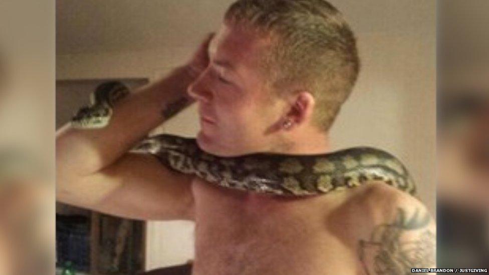 Daniel Brandon with a snake around his neck