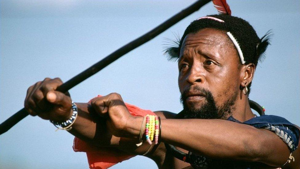 A king's warrior performing a dance during the Icwala festival