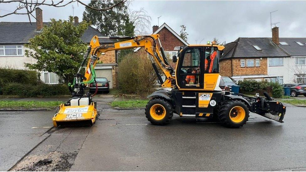 Pothole machine at work in a residential road