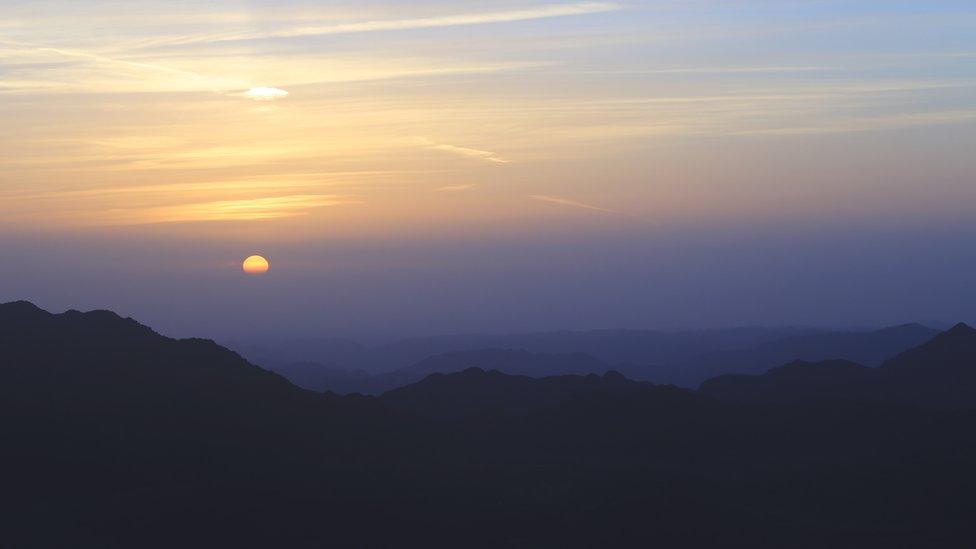 The Sun goes down behind the Gulf of Suez