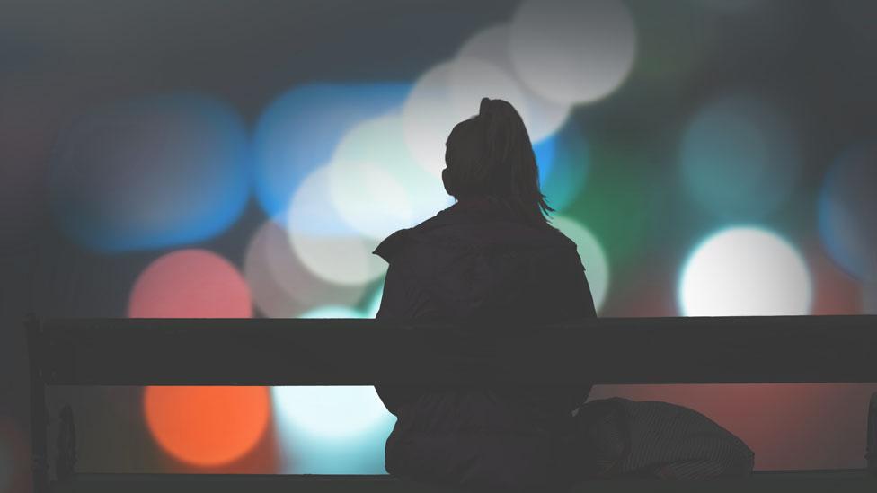 Diabetes programmes logo - image of woman sitting on bench