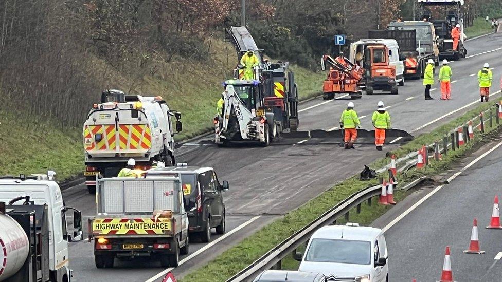 emergency services attending to the scene of the crash on the A1474