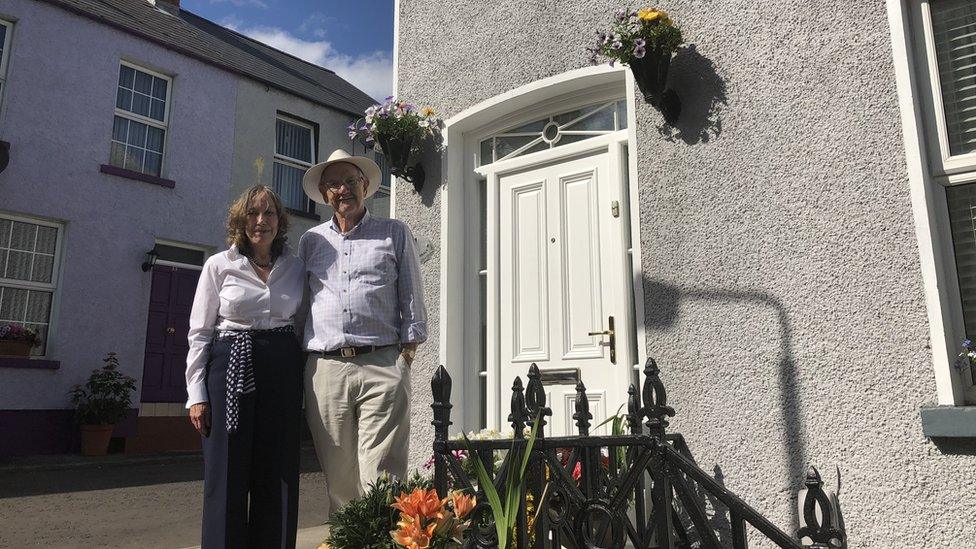 Mauree and Jim Nelis outside their house.