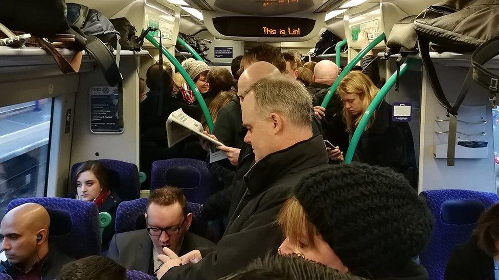 Passengers on Edinburgh to Glasgow train